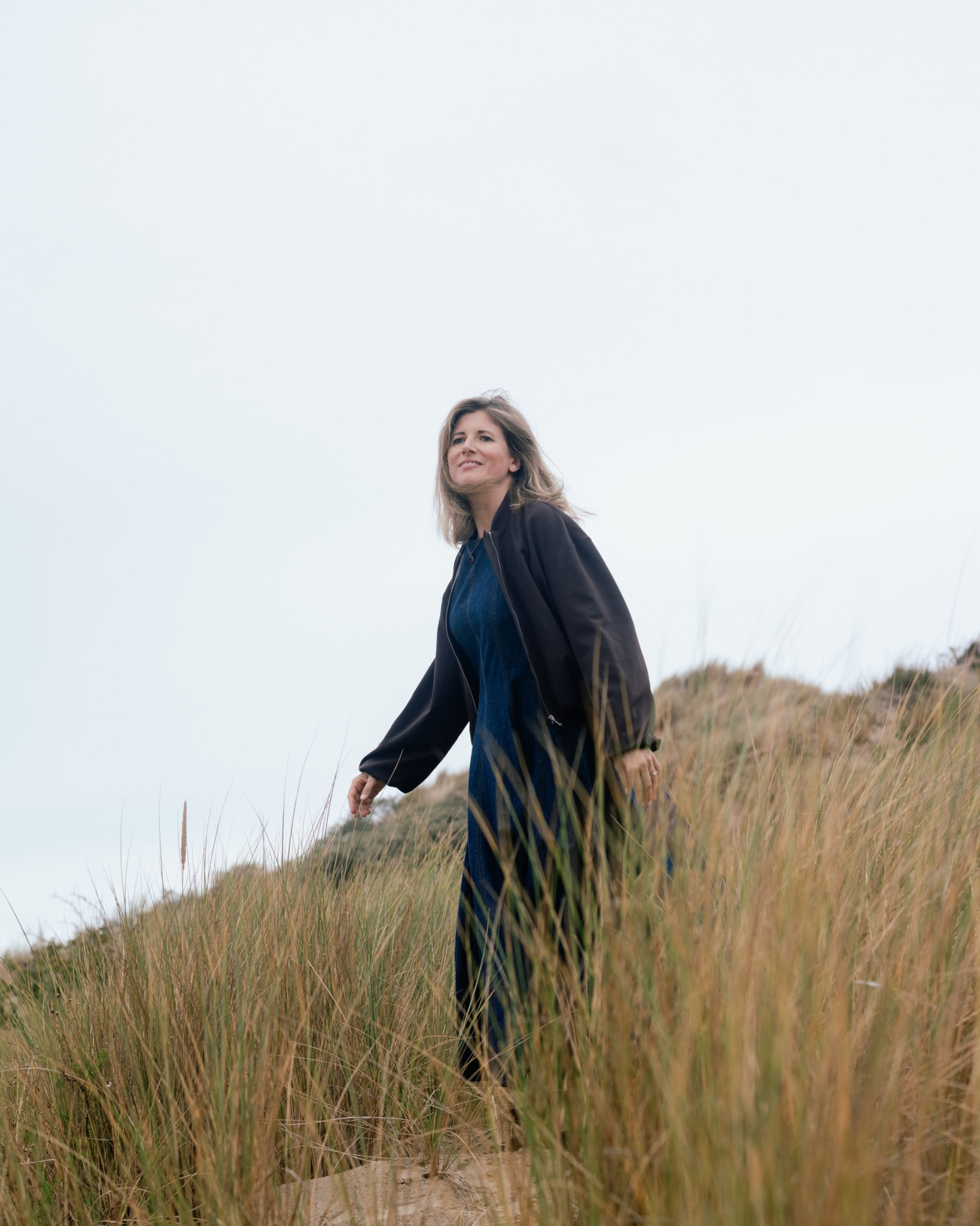 Inge Steemans walking through the coastal dunes
